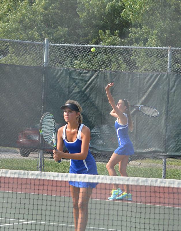 Brooke Griffle, left, and Olivia Ledford compete in a doubles match during a recent home tennis tournament. Photo by Justin Mott
