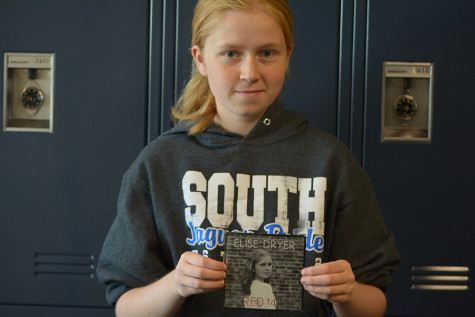 Elise Dryer poses with a copy of her recently released EP.