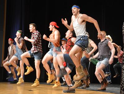 Senior boys perform a dance during Mr. Jag