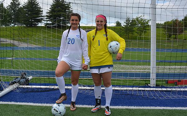 Stine (left) and Swanson (right) before a district game. Photo by Mahlyk Davis