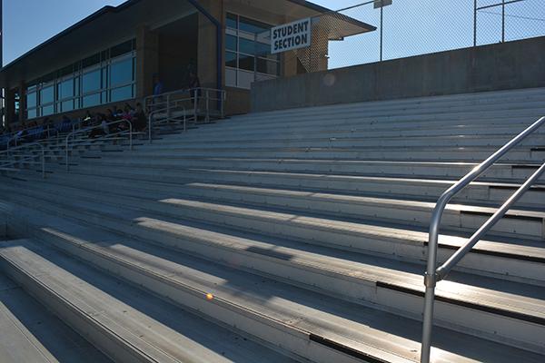 The South student section of the bleachers currently has no benches. The benches were removed for safety, but they are scheduled to be replaced in the spring. Photo by Lauren Collins