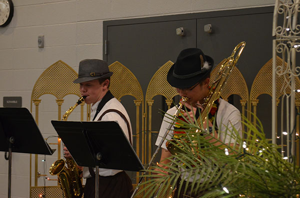 Senior Gehret Ginther and Kody Preud’homme play a classic German song during the Modern Language Fair. Photo by Autumn Campbell.