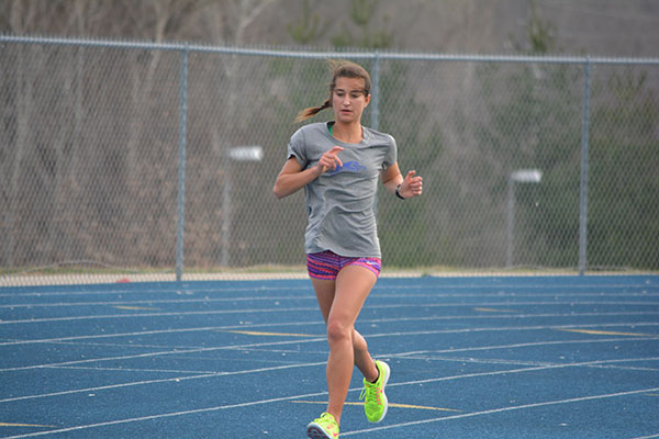 Tori Findley runs during practice, preparing for the first meet of the season. Photo by Emma Anderson.