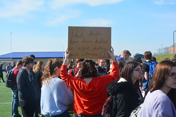 Sophomore Cordelia Williams holds a meaningful sign. She is an active believer in gun control. Photo by Colton Robertson