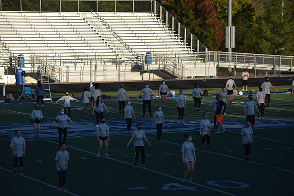 Band is still practicing while wearing masks and social distancing. They are warming up to start rehearsing on their instruments. They would normally perform during half-time and have tournaments on the weekends, but they did not due to Cover-19
photo by Sonnie Hernandez