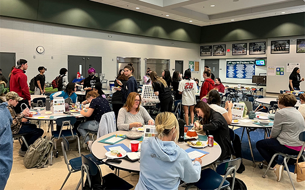 Students help participants paint their bowls during Bowls for Souls on April 13. This was the first time in the history of the event when participants were allowed to glaze their bowls.