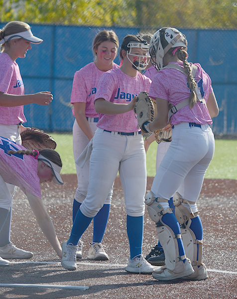 The Jags meet at the mound. They beat Lees Summit West 3 -2.
- Photo by Alex Miranda