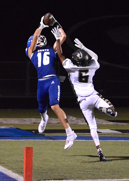 #16 Senior Riley Dower making an impeccable catch for a touchdown in the first game of the season.

- By Alexander Miranda 