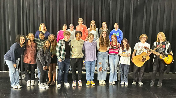 Performers pose for a group photo at the end of Open Mic Night. From poems to songs to forensics routines, students brought variety to the event. Photo submitted by Morgan Smith.