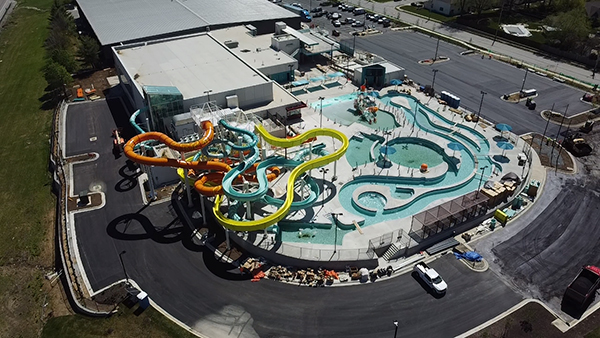 This a photo of the outdoor part of Blue Surf Bay captured by a drone. This part of the park features many water slides, a lazy river, and more.